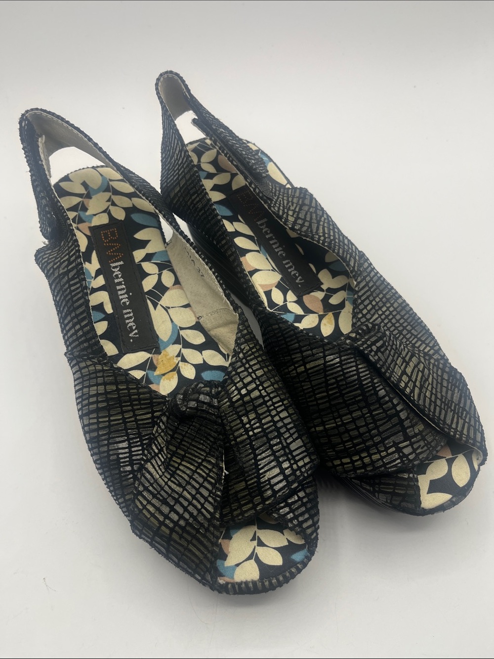bernie mev. Black Textured Slingback Peep-Toe Wedges with Floral Insole